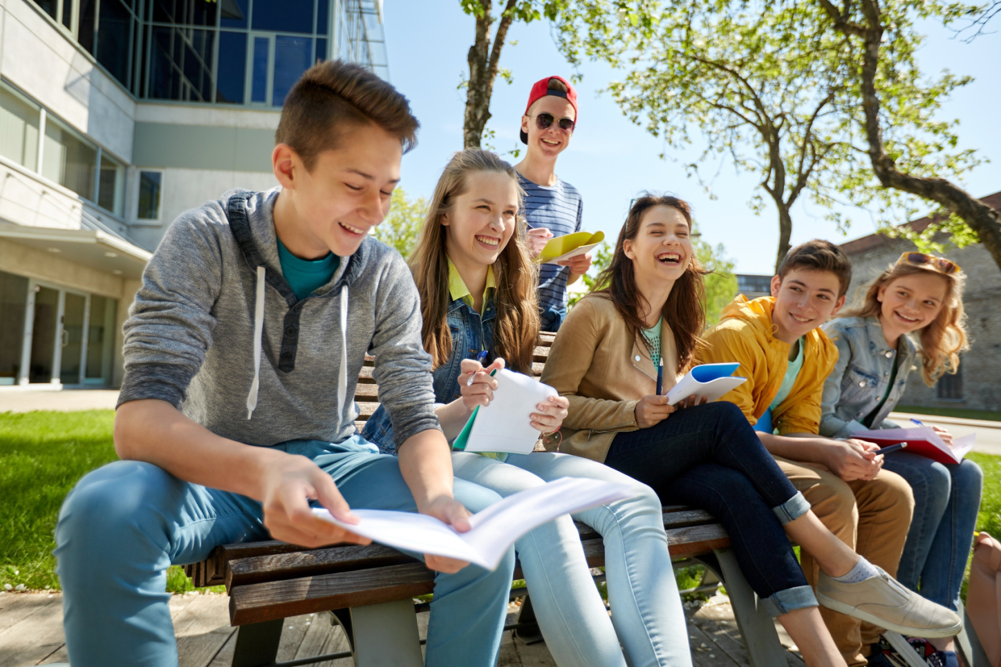 group of students with notebooks at school yard